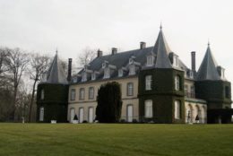 La Hulpe, Belgium - March 26, 2018: The Chateau de La Hulpe is a 19th-century French style castle in the Wallonia province of southern Belgium outside Brussels. The château was completed in 1842 in Flemish Neo-Renaissance style, flanked by towers at each of the four corners. In the late 19th century, the house and estate were acquired by Ernest Solvay.
