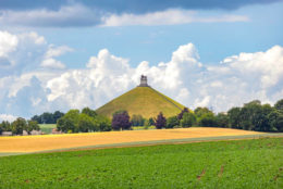 The Lion's Mound (French: Butte du Lion, Dutch: Leeuw van Waterloo,. "Lion of Waterloo") is a large conical artificial hill located in the municipality of Braine-l'Alleud, Belgium. King William I of the Netherlands ordered its construction in 1820, and it was completed in 1826. It commemorates the location on the battlefield of Waterloo where a musket ball hit the shoulder of William II of the Netherlands (the Prince of Orange) and knocked him from his horse during the battle It is also a memorial of the Battle of Quatre Bras, which had been fought two days earlier, on 16 June 1815.